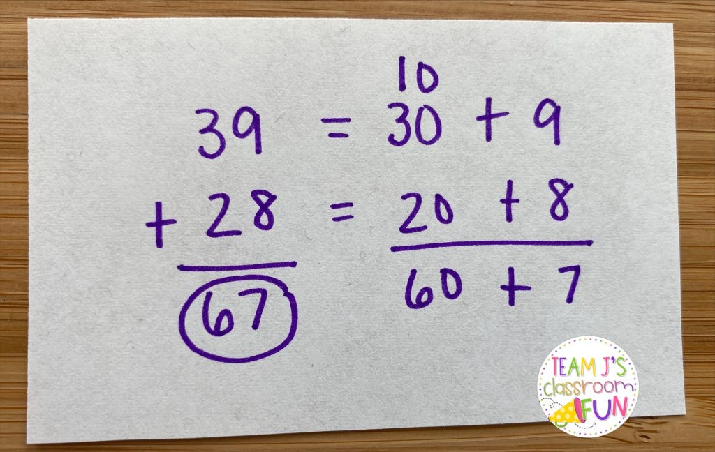 Photo of expanded form addition math strategy.